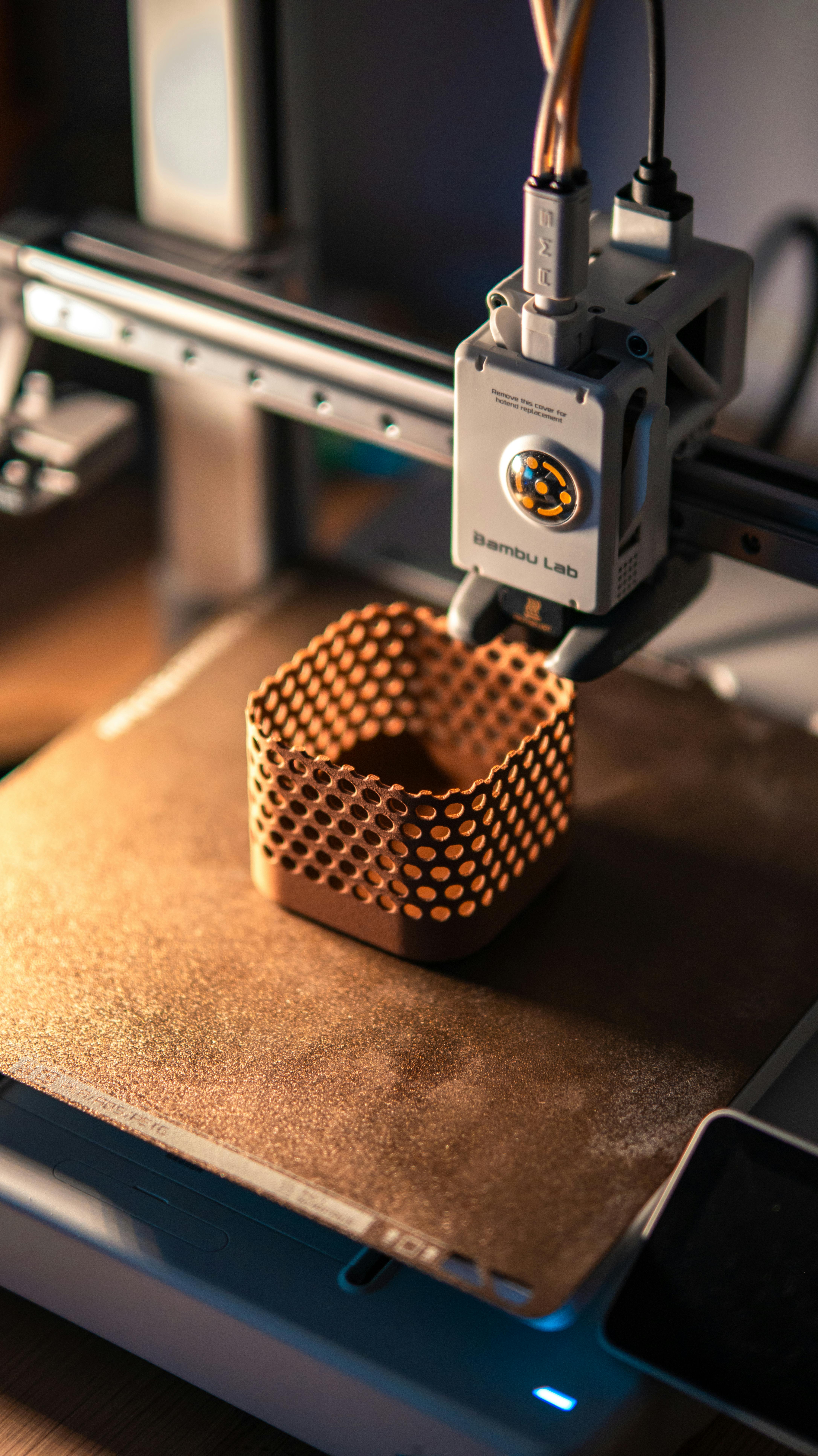 Bambu Lab FDM printer actively producing a precision lattice structure, representing the technical depth of Cascade Forge's fabrication capability
